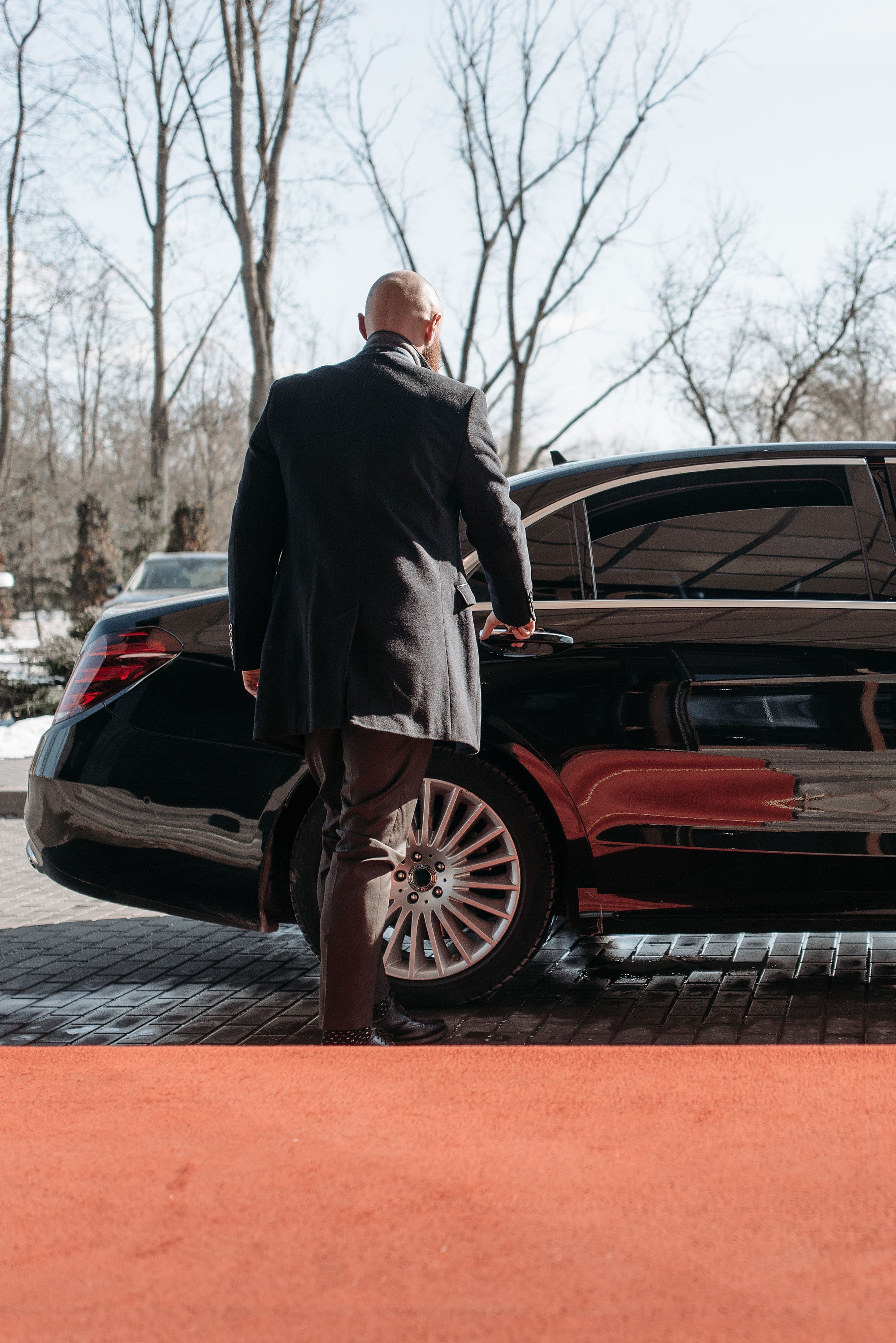 Chauffeur opening the car door